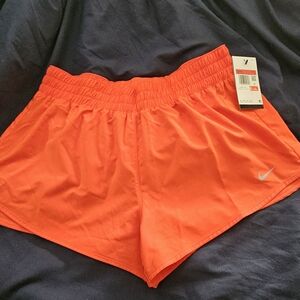 Nike Women’s Bright Orange Athletic Shorts with Swoosh